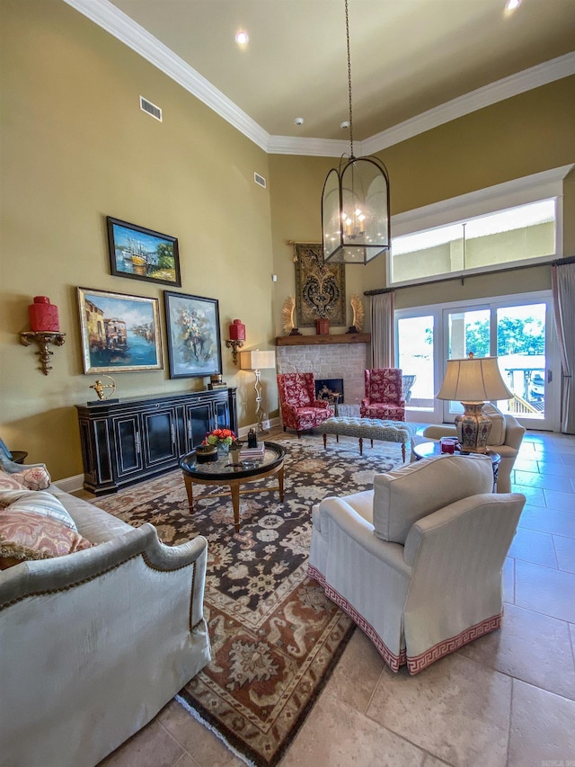 tiled living room featuring an inviting chandelier, a high ceiling, and ornamental molding