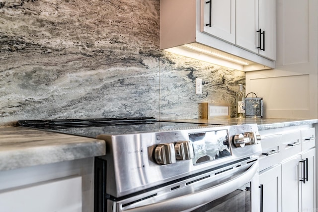 kitchen with white cabinetry and electric stove