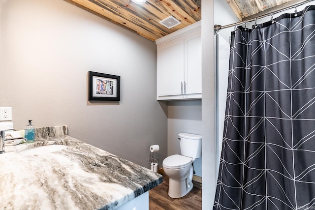 bathroom with toilet, wood ceiling, vanity, and hardwood / wood-style flooring