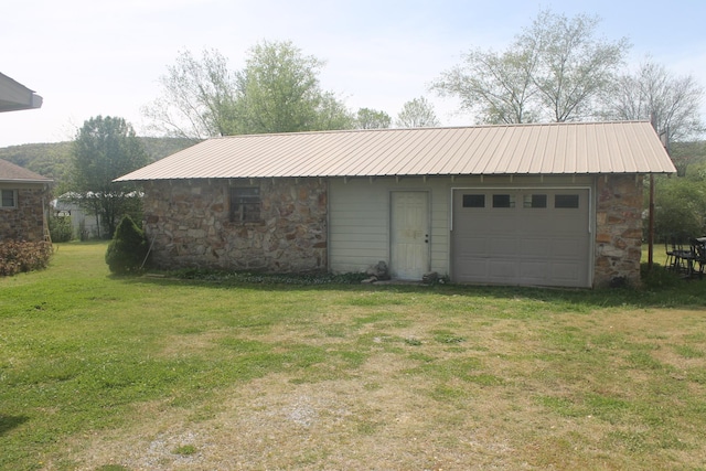 garage featuring a yard