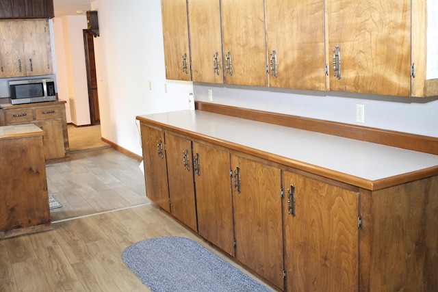 kitchen with light hardwood / wood-style floors