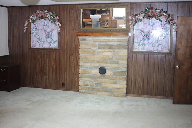 interior space featuring carpet floors and wood walls