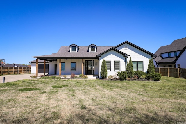 view of front of house with a garage and a front lawn