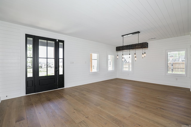 entryway with plenty of natural light and dark wood-type flooring