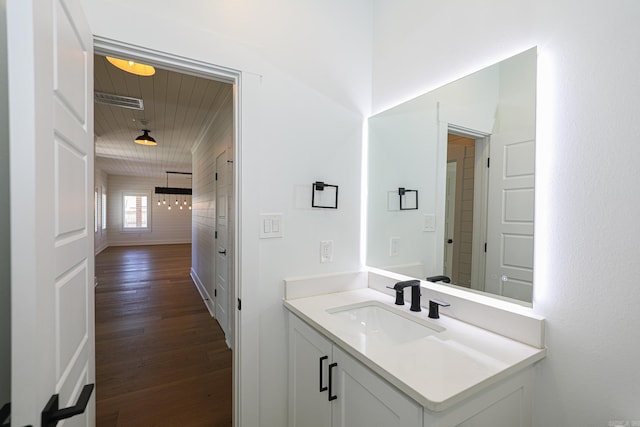 bathroom featuring vanity and wood-type flooring