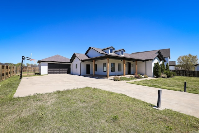 view of front of house featuring a front yard and a garage