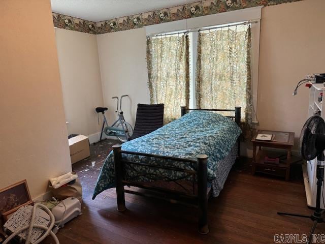 bedroom featuring dark wood-type flooring