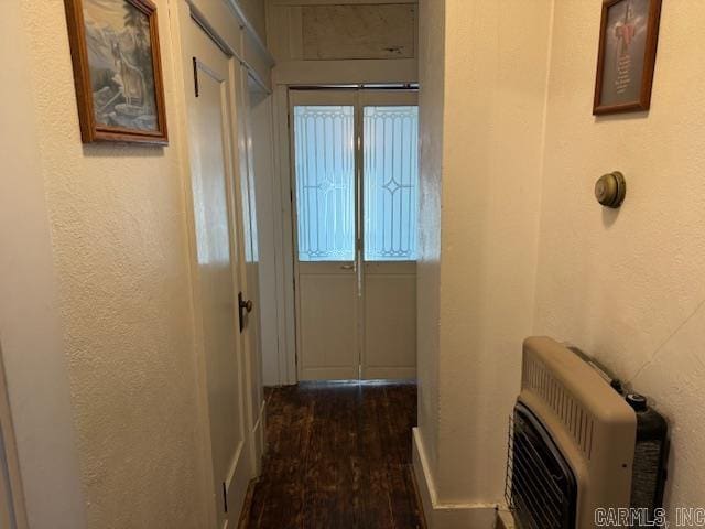 hallway with dark hardwood / wood-style flooring