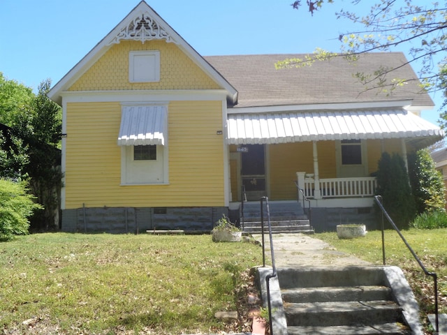 view of front of property with a porch and a front yard