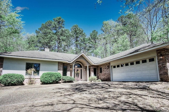 ranch-style house featuring a garage