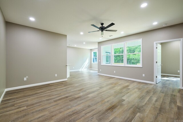 spare room with ceiling fan and hardwood / wood-style flooring