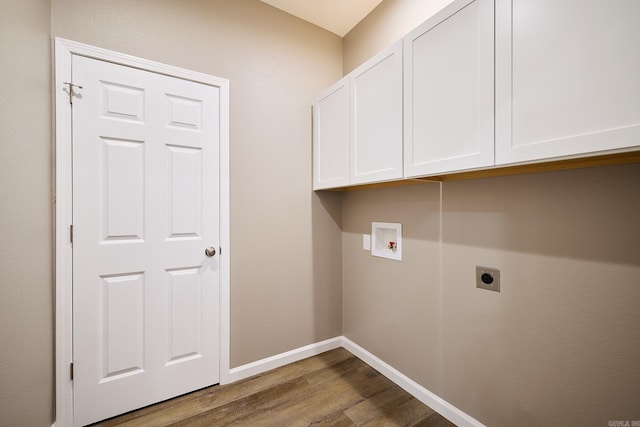 washroom with dark hardwood / wood-style flooring, cabinets, hookup for a washing machine, and electric dryer hookup