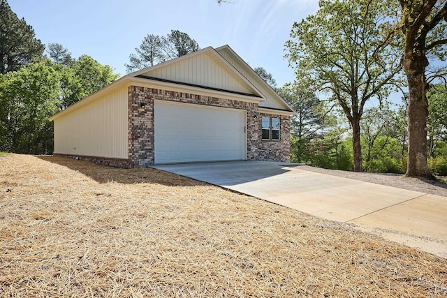 view of property exterior with a garage and an outbuilding