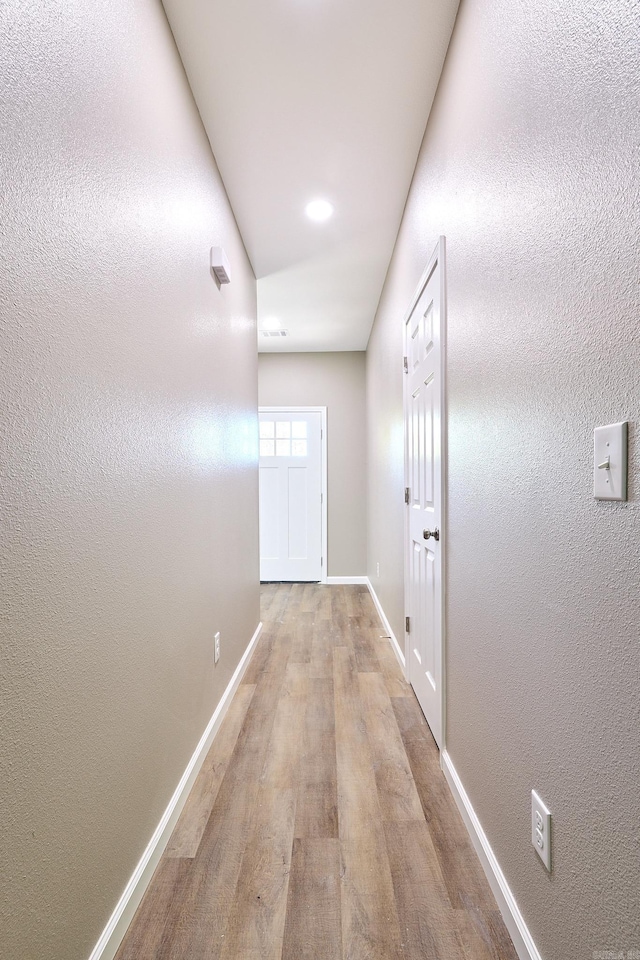 hallway featuring light wood-type flooring