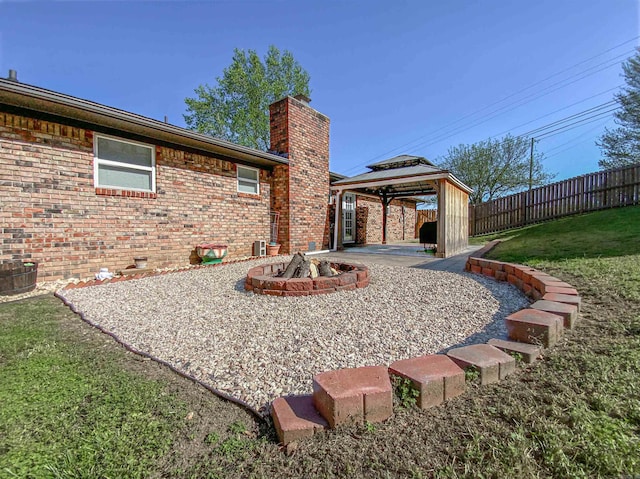 exterior space with a patio area, a gazebo, and a lawn