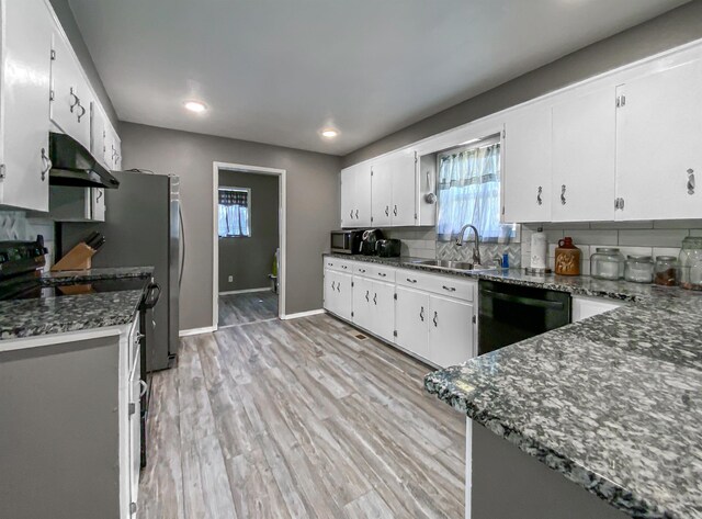 kitchen featuring white cabinets, backsplash, light hardwood / wood-style floors, and dishwasher