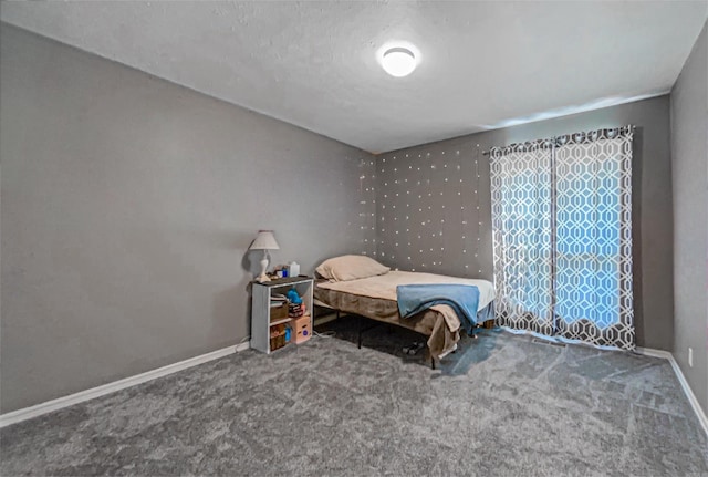 bedroom with dark carpet