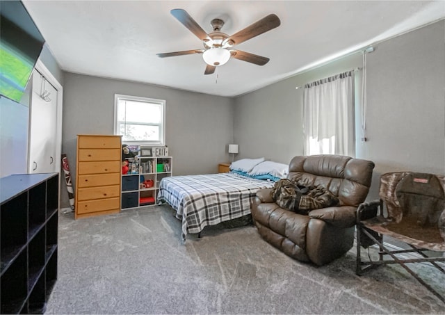 bedroom featuring ceiling fan and carpet floors