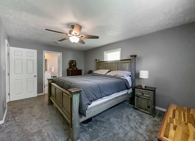 bedroom with ensuite bath, ceiling fan, and dark carpet