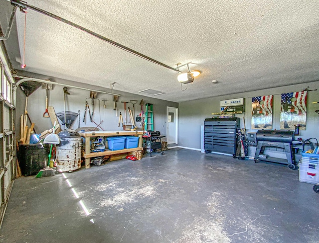 garage featuring a workshop area and a garage door opener