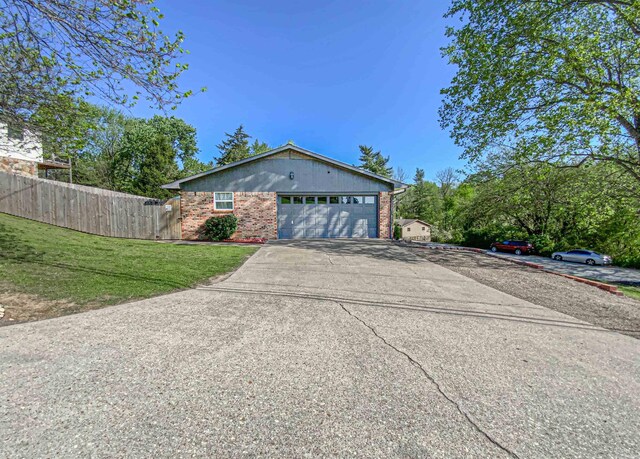 view of front of home with a garage and a front yard