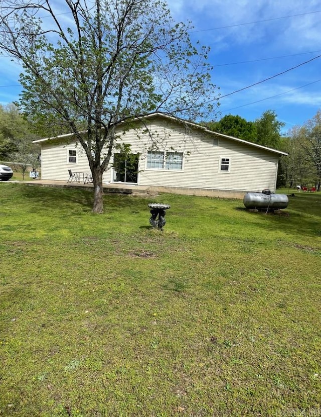 view of home's exterior with a lawn