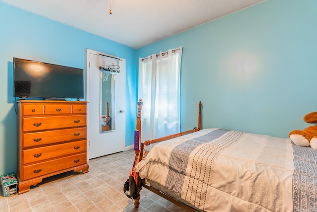 bedroom featuring light tile floors