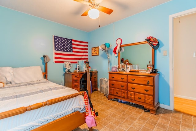 tiled bedroom with ceiling fan