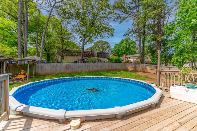 view of swimming pool featuring a wooden deck