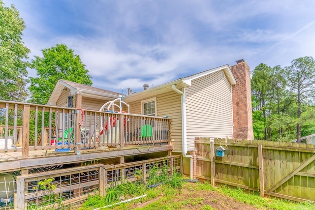 back of property featuring a deck