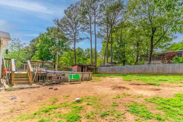 view of yard with a wooden deck