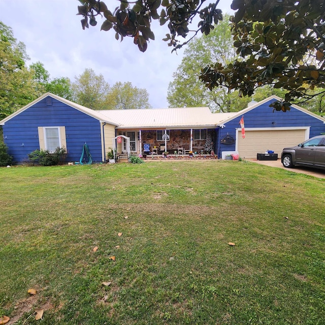 ranch-style home featuring a garage and a front lawn