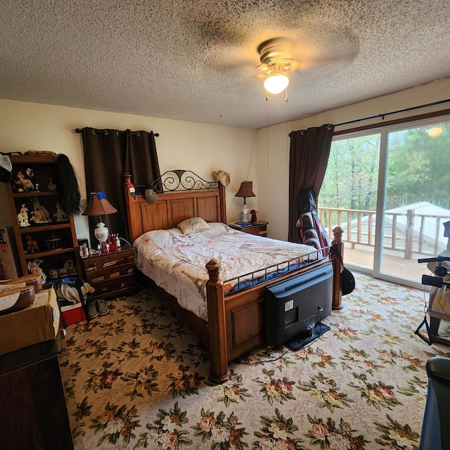 bedroom with light colored carpet, ceiling fan, access to exterior, and a textured ceiling