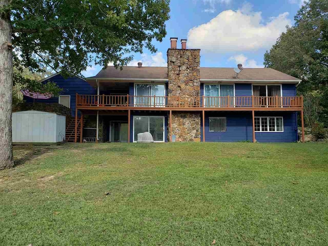 back of property with a storage shed and a yard