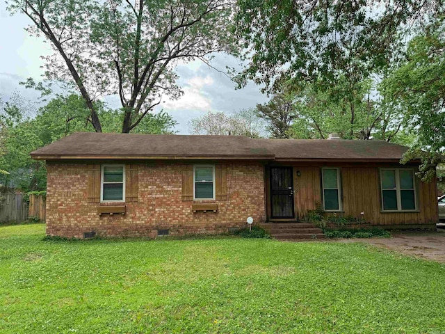 ranch-style home with a front lawn