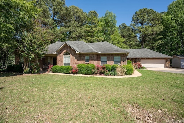 view of front of property with a garage and a front yard