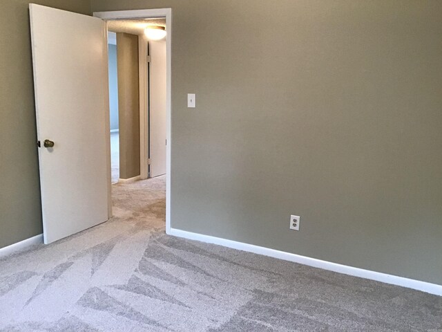 unfurnished room with carpet