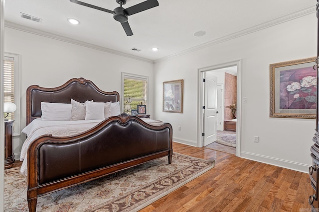 bedroom with ceiling fan, hardwood / wood-style flooring, connected bathroom, and ornamental molding