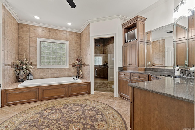 bathroom featuring tile walls, vanity, tile flooring, shower with separate bathtub, and ceiling fan