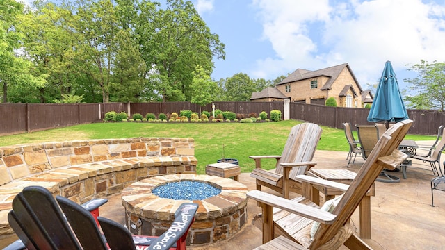 view of terrace with a fire pit