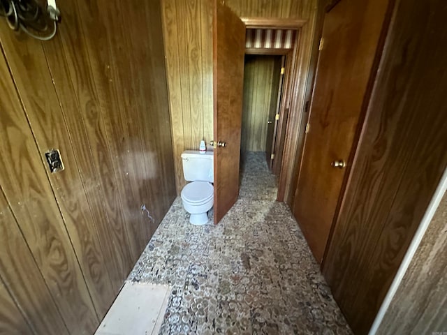 hallway with wooden walls