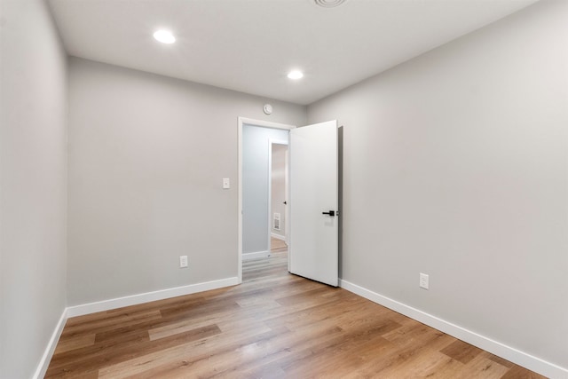 spare room with light wood-type flooring