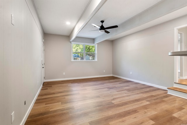 empty room with light hardwood / wood-style floors and ceiling fan