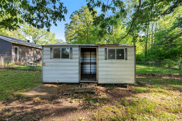 view of outdoor structure featuring a yard