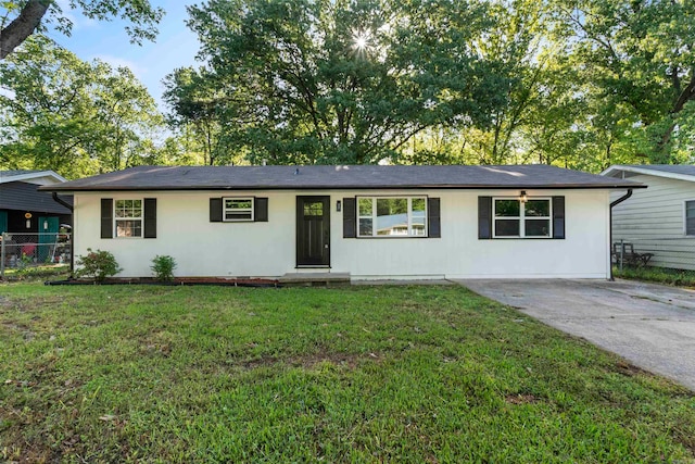 ranch-style home featuring a front yard