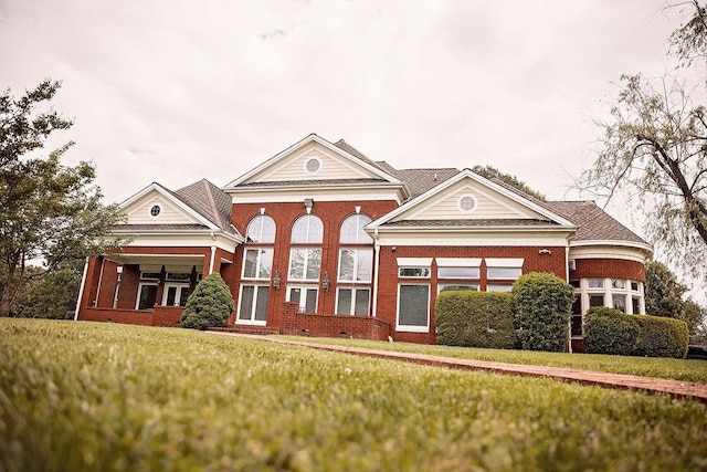 greek revival house with a front lawn