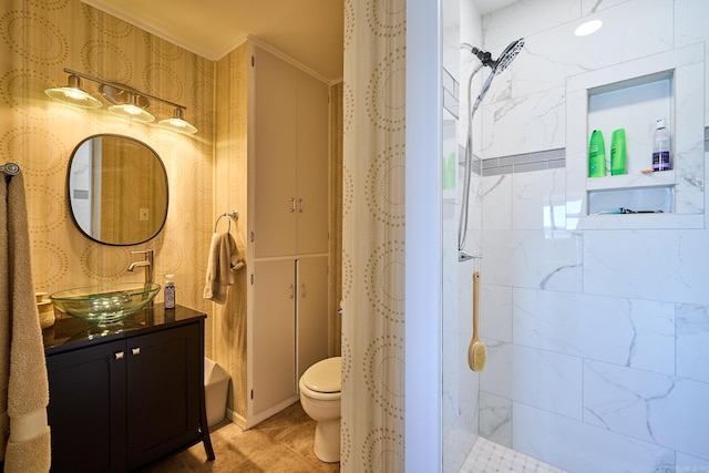 bathroom featuring ornamental molding, tile floors, vanity, and toilet