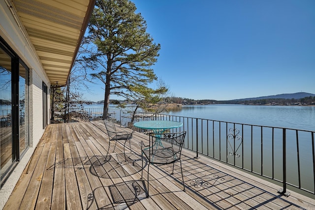 deck featuring a water view