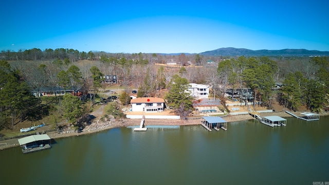 drone / aerial view with a water and mountain view