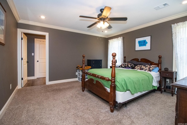 carpeted bedroom featuring multiple windows, ornamental molding, and ceiling fan